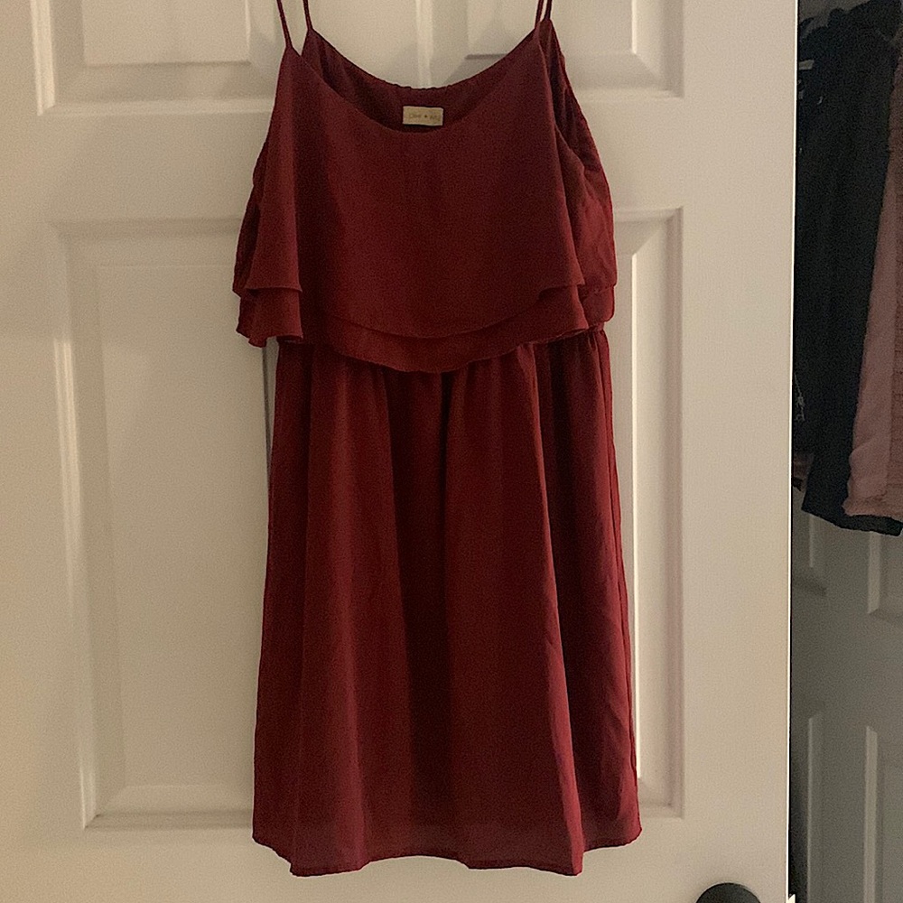 Garnet colored thin strap dress with ruffle top and straight/flow bottom.